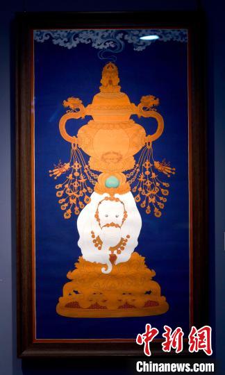 圖為5月16日，展覽中的新創(chuàng)唐卡作品《瑞象承香》?！±盍?攝